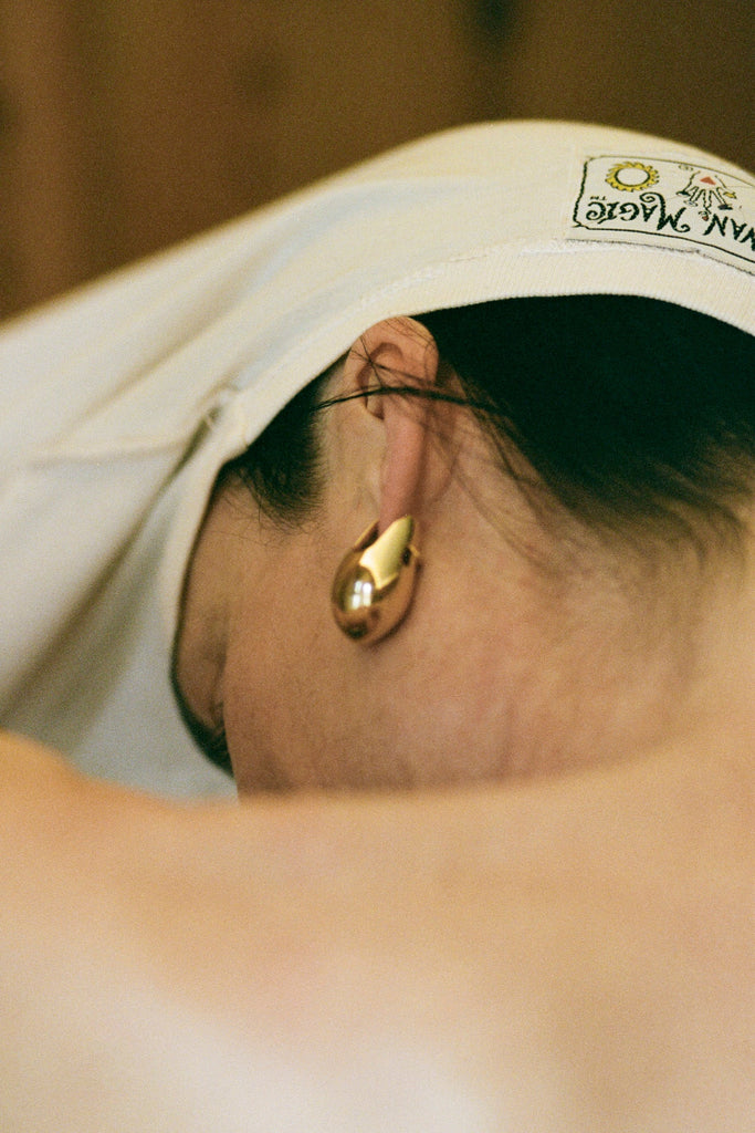 Back view of Aubergine Astrid earring – sculptural aubergine-inspired jewelry design by ANNE MANNS