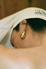 Back view of Aubergine Astrid earring – sculptural aubergine-inspired jewelry design by ANNE MANNS